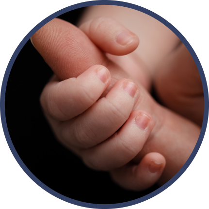 baby holding finger